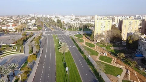 Camera on the drone flies on direction of the crossroad in Beer-Sheva Stock Footage 125210573