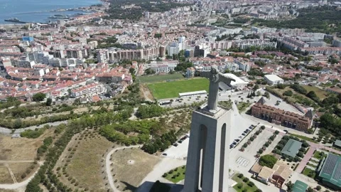 A camera drone flies forward above the Sanctuary of Christ the King in Lisbon Stock Footage 202016178