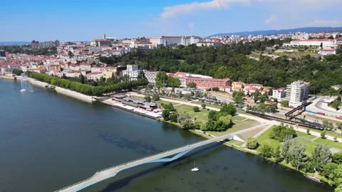A camera drone flies forward across Mondego River Stock Footage 202024508