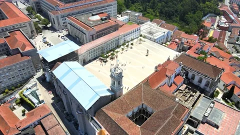 A camera drone flies forward over the University of Coimbra campus Stock Footage 202012510