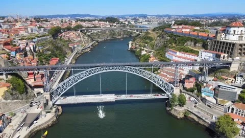 A camera drone flies forward over the Douro River, Porto Stock Footage 202060783