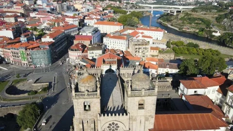 A camera drone flies forward over the Porto Cathedral Stock Footage 202061272