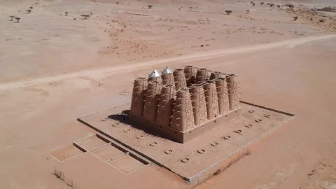 Camera drone flies over the abandoned traditional mud brick Arab dovecote Stock Footage 153521930