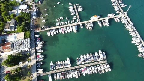 A camera drone flies over the Budva promenade and Dukley Marina Stock Footage 249418959