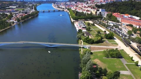 A camera drone flies sidewise across Mondego River Stock Footage 202024582