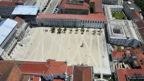 A camera drone flies sidewise over the University of Coimbra campus Stock Footage 202012321