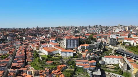 A camera drone flies towards the Episcopal Palace and Porto Cathedral Stock Footage 202061089