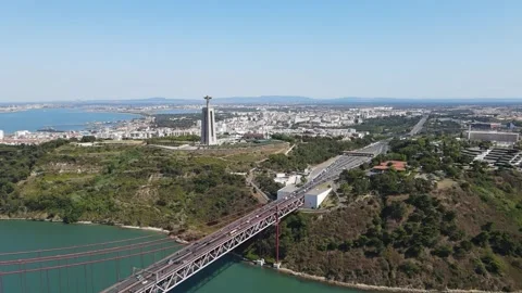 A camera drone flies towards the Sanctuary of Christ the King in Lisbon Stock Footage 202013152