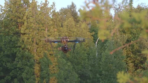 Camera Drone in flight through trees Stockbeeldmateriaal 22218490