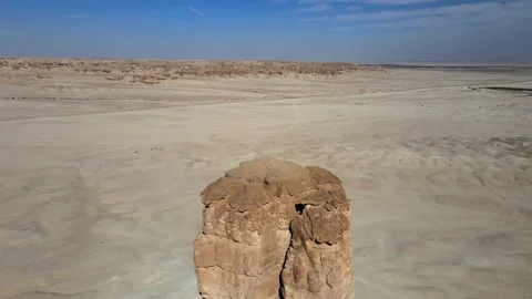 A camera drone is flying backward and above Judah Thumb, also known as Devil's T Stock Footage 265013592