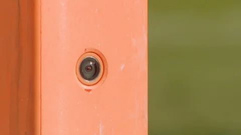 Camera embedded in end zone pylon of football field Stock Footage 102103871