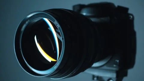 A camera with an expensive lens with aperture of 1.5 and a focal length of 85mm Stock Footage 313146685