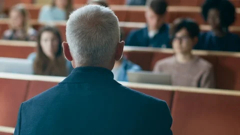 Camera Facing Class: College Professor Gives a Lecture to a Students.  Stock Footage 87975375