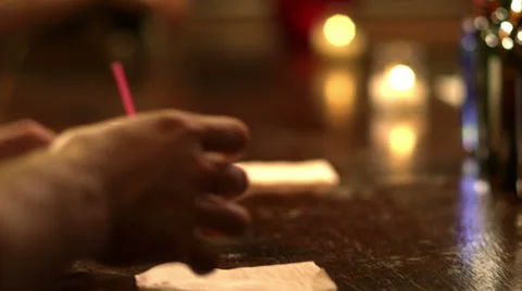 The camera fallows drinks as they are served by the bartender Stock Footage 33998695