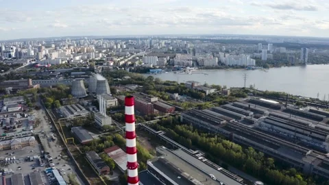 The camera is filming a modern plant from a drone Видео 163951153