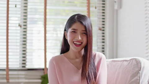 Camera first view Beautiful Asian young woman talking and introducing myself  Video stock 166401938