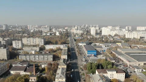 The camera flies along a long road in the city. Stock Footage 100992802