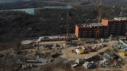 The camera flies around the construction site on the outskirts of the city Stock Footage 106600341