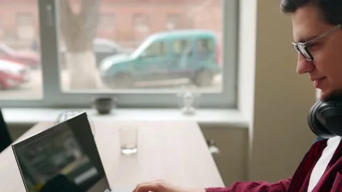 Camera flies around developer writing program code on computer display alone in Stock Footage 217734344