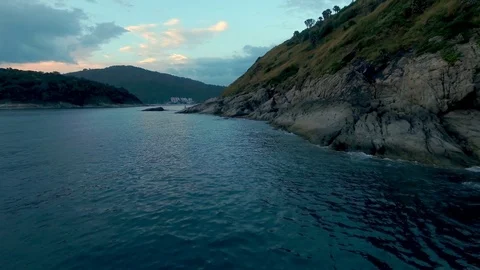 Camera flies around the rocks in the sea 動画素材 73516319