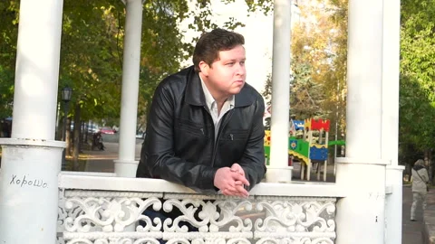 The camera flies around a young man in the park Stock Footage 87787887