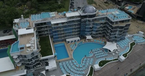 Camera flies back tracking the Nemo Hotel and Dolphinarium Stock Footage 76828088