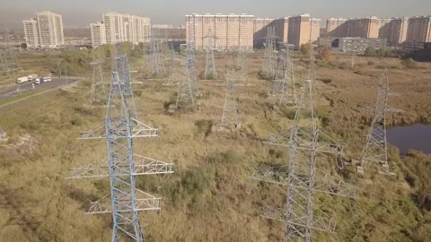 Camera flies beautifully between a large cluster of power lines Video stock 166735100