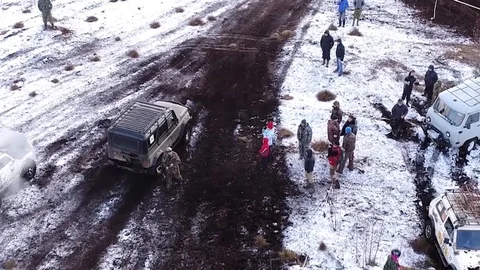 The camera flies behind the SUV from above Stock Footage 101107194