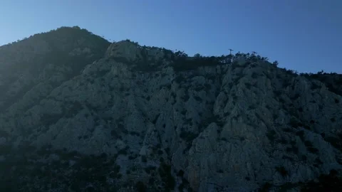 The camera flies from below to the top of the mountain to the funicular Stock Footage 229455019