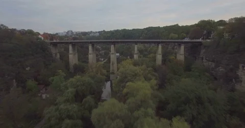 Camera flies low and backward from the Bridge in Kamianets-Podilski Stock Footage 69898326