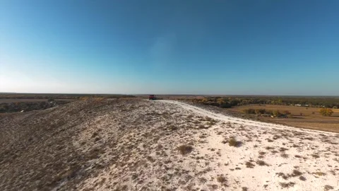 The camera flies low over the chalk mountains Stock Footage 288195220