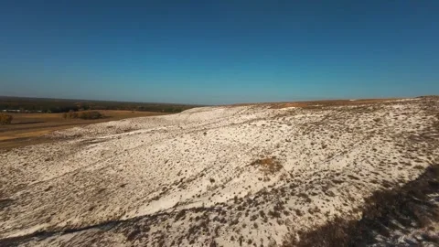 The camera flies low over the chalk mountains Stock Footage 288195238