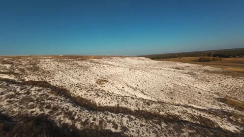 The camera flies low over the chalk mountains Stock Footage 288195245