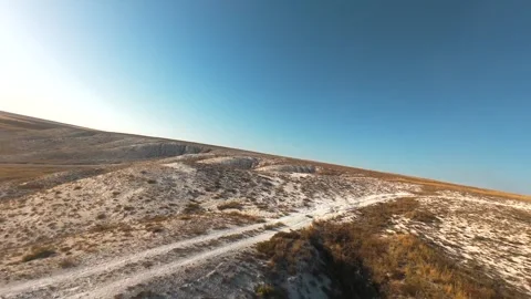 The camera flies low over the chalk mountains Stock Footage 288195249