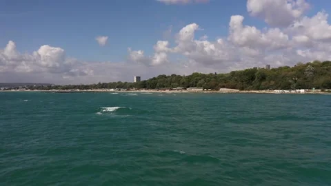 The camera flies low over the sea. Big waves in the Black Sea rush to the shore. Video stock 137096659