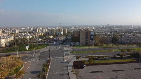 Camera flies from other side on direction of the crossroad in Beer-Sheva Stock Footage 125483654