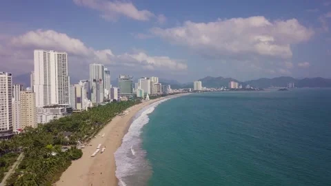 Camera flies over the beach overlooking the city Stock Footage 261637331