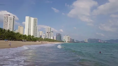 Camera flies over the beach overlooking the city Stock-Footage 261639084