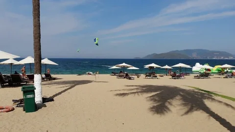 The camera flies over the beautiful beach and resort town in Asia Stock Footage 100188216