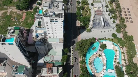 The camera flies over the beautiful beach and resort town in Asia Stock Footage 100190101