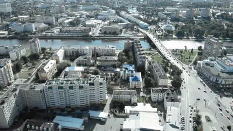 The camera flies over the city along the river. Stock Footage 95300660