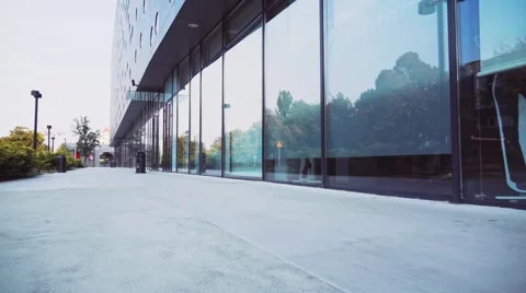Camera flies over empty morning City Street . Steadicam stabilized shot. Stock-Footage 55260082