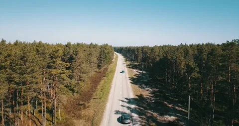 The camera flies over an empty road on a sunny day Stock Footage 146701014
