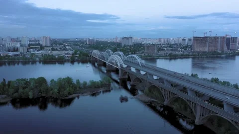 The camera flies over the iron bridges in the center of the river Stock Footage 156964557