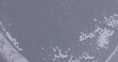 The camera flies over the lake, cold winter in Russia, aerial photography Stock Footage 83581540