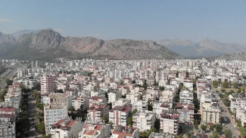 The camera flies over a large city of white houses Stock Footage 220856776