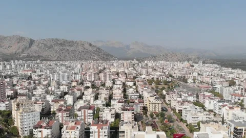 The camera flies over a large city of white houses Stock Footage 221243557