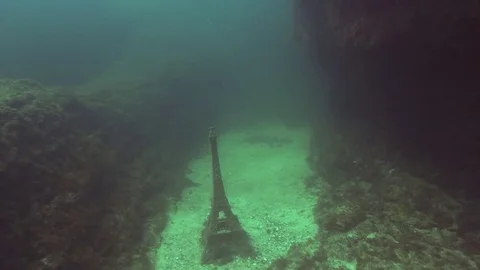 Camera flies over a model eiffel tower underwater in Black Sea, Crimea. Stock Footage 82986074