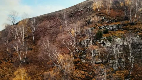 The camera flies over the mountain with a view of the mountains Stock Footage 171295534