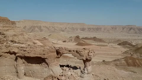 The camera flies over The Natural Arch of Riyadh Stock Footage 153038765